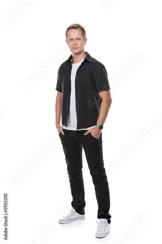 Handsome stylish man showing posing in casual clothes.