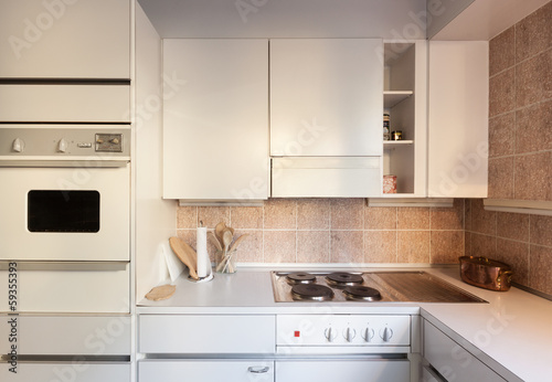 Interior, domestic kitchen, white cabinet