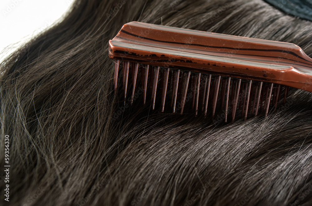 Obraz premium Comb, hairbrush and hair on white background