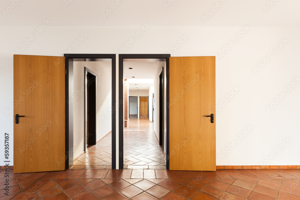 Architecture, interior, empty room with two doors.