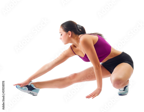 Young sporty girl doing gymnastic exercises