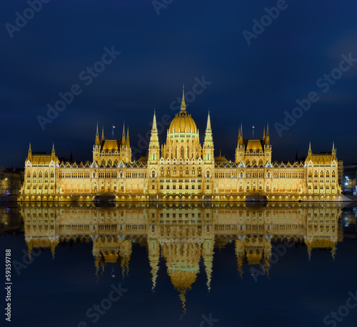 Budapest  Parlament beleuchtet mit Spielgelung in Donau photo