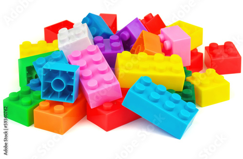 Plastic colorful toy blocks on white background
