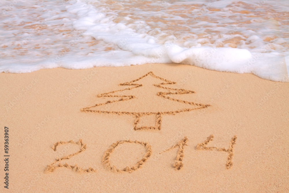 Year 2014 written in sand on tropical beach Year 2014 written in sand on tropical beach