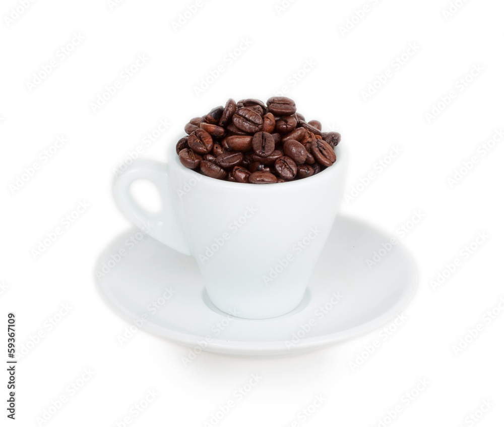white cup and saucer filled with coffee beans white cup and saucer filled with coffee beans