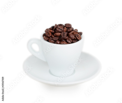 white cup and saucer filled with coffee beans