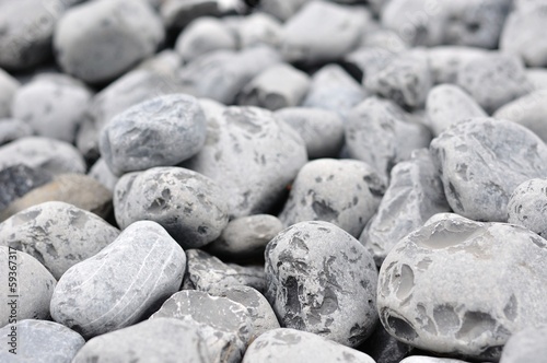 Background of small gray rocks. Shallow DOF