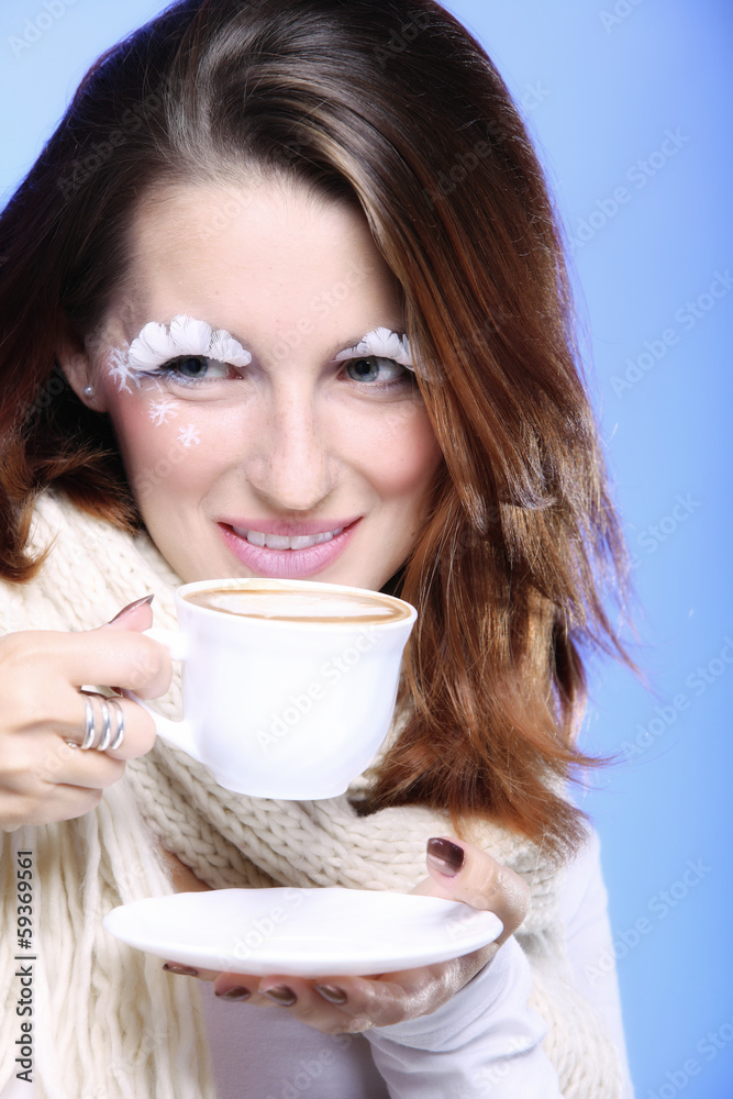 Winter makeup woman with cup of hot latte coffee Winter makeup woman with cup of hot latte coffee