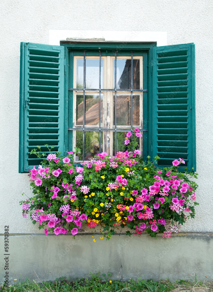 wooden window decorated with flowers