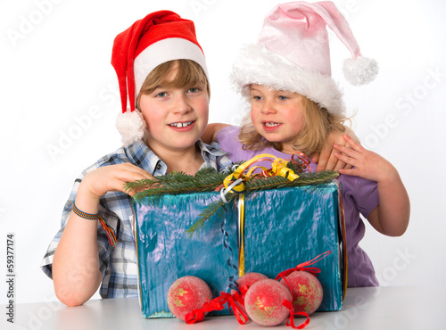 boy and girl withchristmas present photo