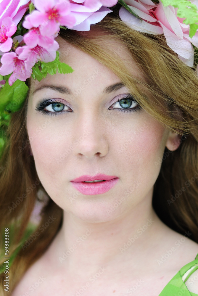 Beautiful girl in a flowered garden peach Beautiful girl in a flowered garden peach