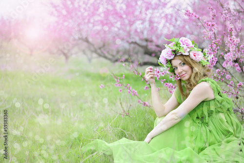 beautiful girl in the flowered garden peach