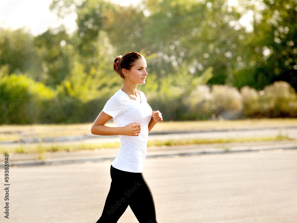 Athletic Runner Training in a park for Marathon. Athletic Runner Training in a park for Marathon.