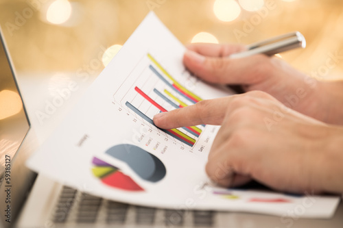 Businessman analyzing investment with laptop