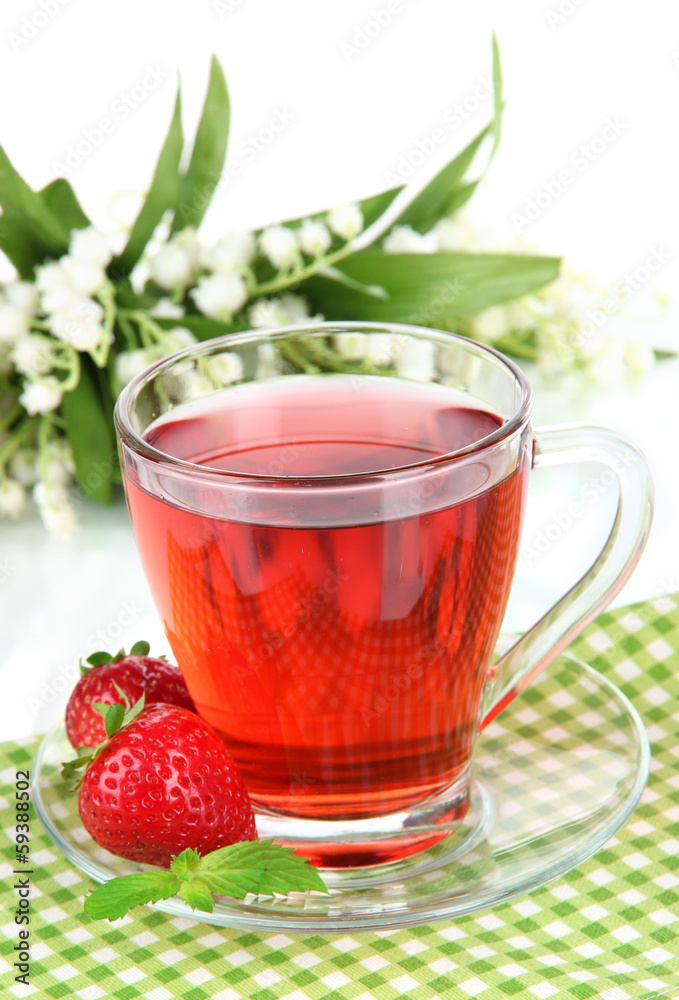 Delicious strawberry tea on table on white background Delicious strawberry tea on table on white background