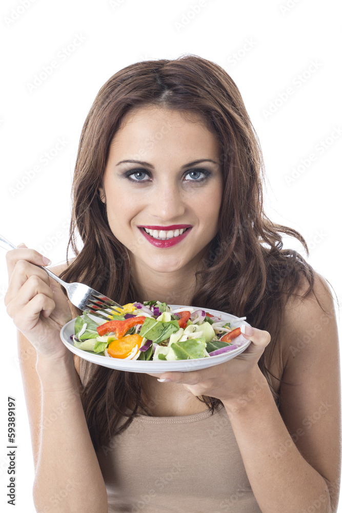 Attractive Young Woman Eating Stir Fried Vegetables Attractive Young Woman Eating Stir Fried Vegetables