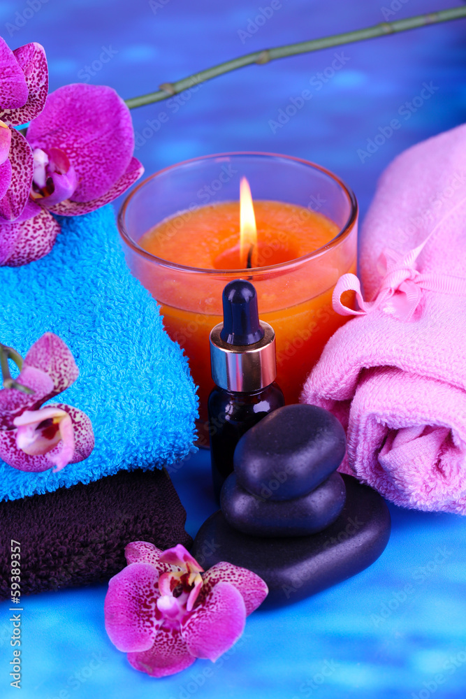 Beautiful spa setting with orchid on blue background Beautiful spa setting with orchid on blue background