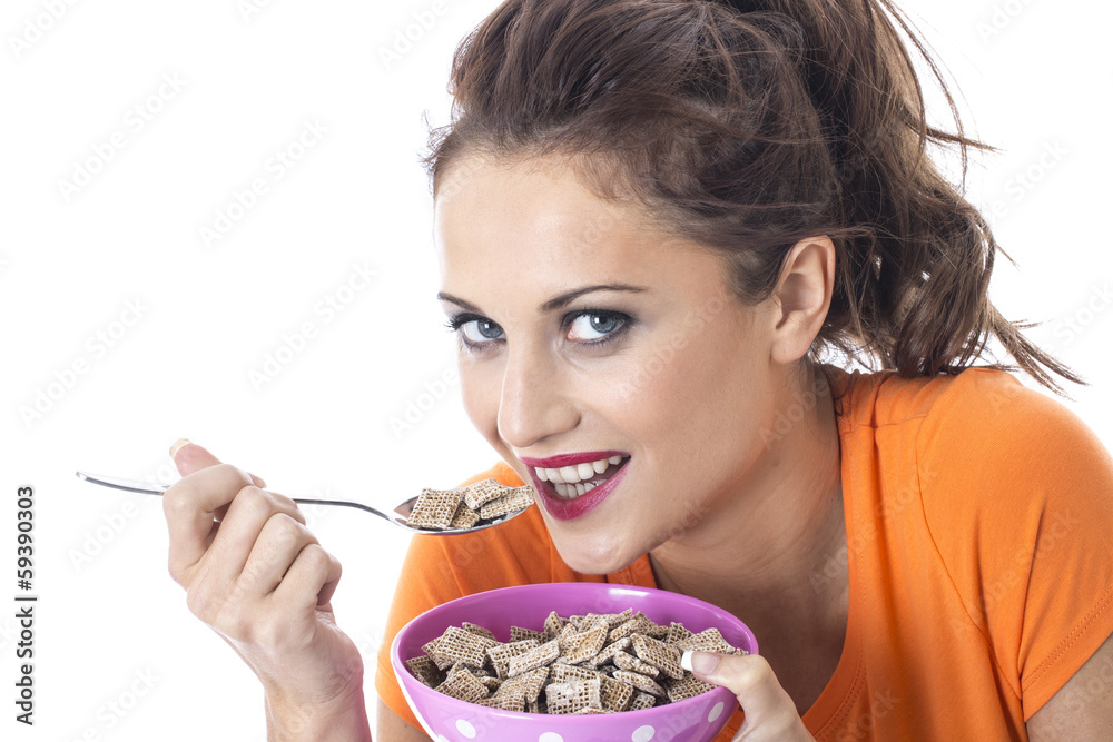 Young Woman Eating Breakfast Cereal Young Woman Eating Breakfast Cereal