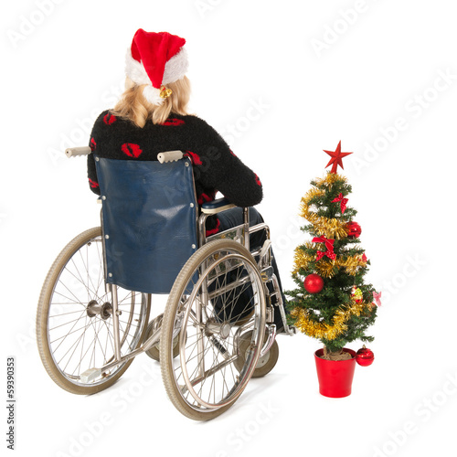 woman in wheel chair with Christmas tree photo