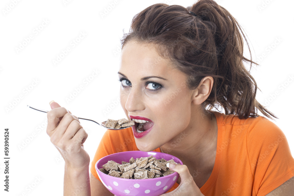 Young Woman Eating Breakfast Cereal Young Woman Eating Breakfast Cereal
