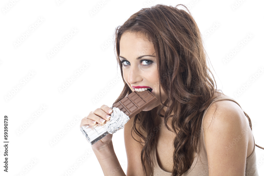 Naklejka premium Young Woman Eating Chocolate