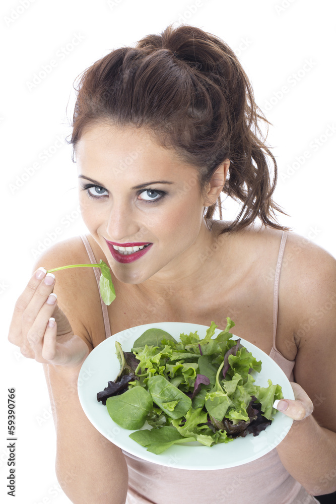 Young Woman Eating Green Leafed Salad Young Woman Eating Green Leafed Salad