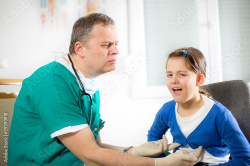 Doctor with little girl