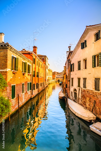 Venice cityscape, water canal, bridge and traditional buildings. © stevanzz