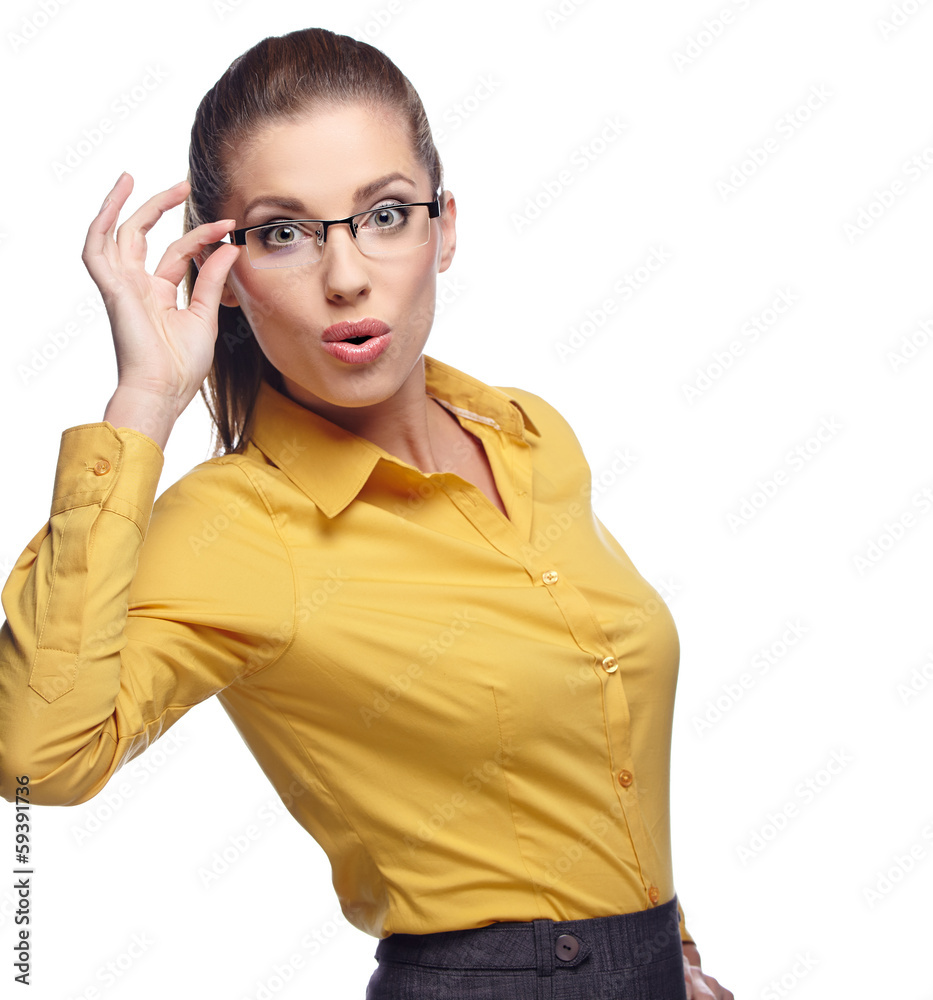 Portrait of a beautiful young business woman standing against wh Portrait of a beautiful young business woman standing against wh