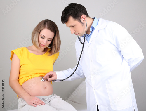 Young pregnant woman sitting