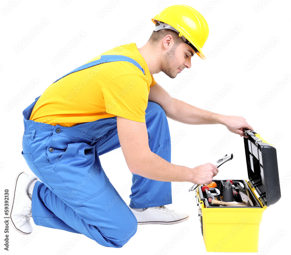 Male builder in yellow helmet isolated on white Male builder in yellow helmet isolated on white