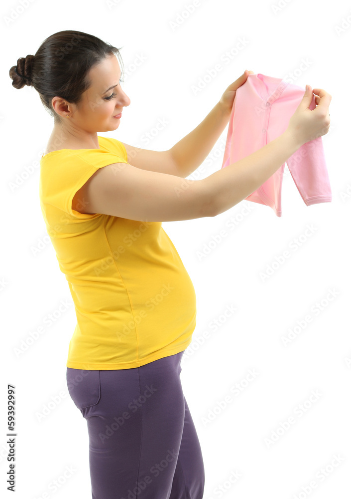Young pregnant woman holding pink baby cardigan isolated Young pregnant woman holding pink baby cardigan isolated