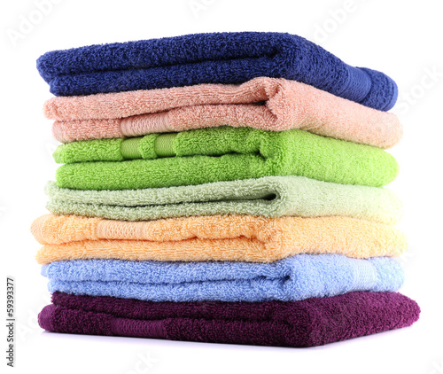 Colorful towels isolated on white © Africa Studio