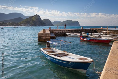 Fishing boats float moored in Petrovac, Montenegro