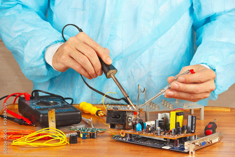 Master solder electronic components of device in workshop