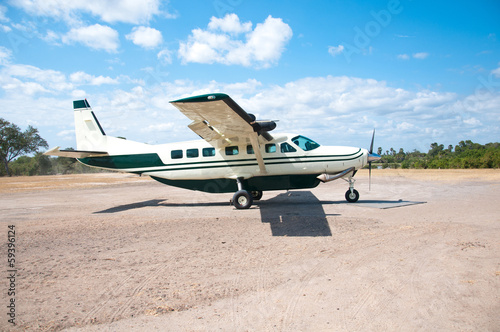 parked airplane on the landing runway in tanzania