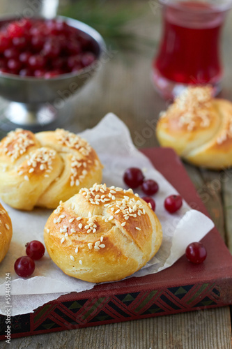Homemade bread rolls with sesame seeds and cranberry