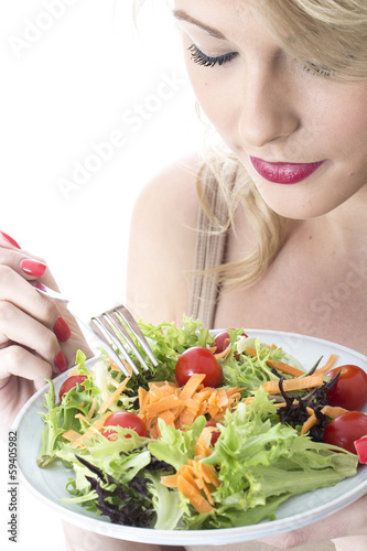 Young Woman Eating Salad