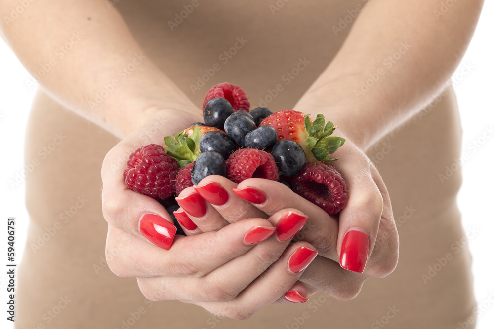 Young Woman Holding a Handful of Mixed Berries