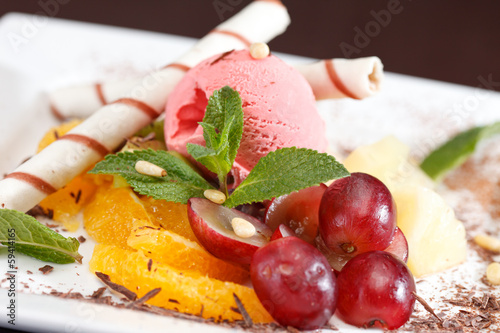 tasty dessert with ice cream and fruits