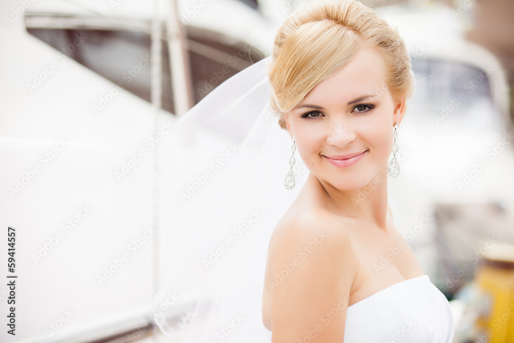 Happy bride posing in her wedding day