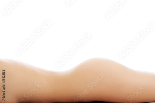 Beautiful naked woman lying on floor.