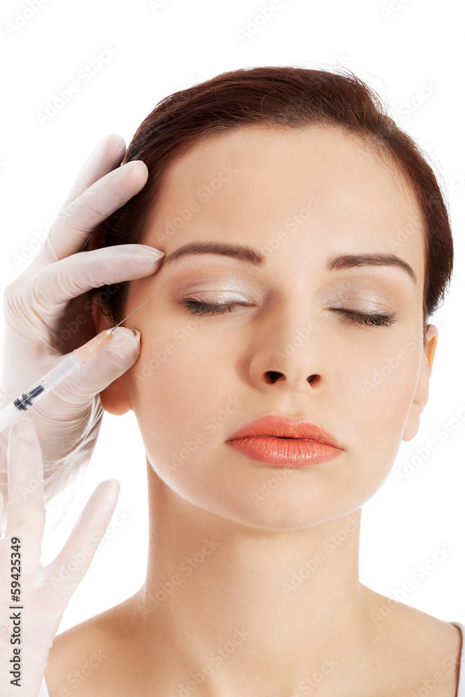 Beautiful woman's face is being prepareg to plastic surgery.