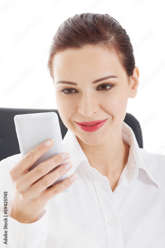 Beautiful young business woman with mobile phone. Beautiful young business woman with mobile phone.