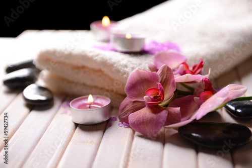 Still life with beautiful blooming orchid flower  towel and spa