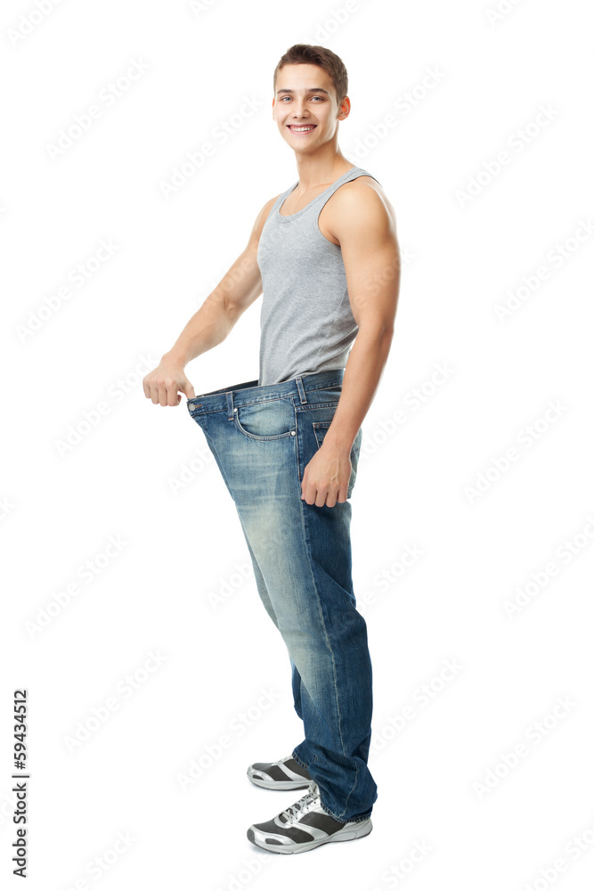 Man showing how much weight he lost Man showing how much weight he lost