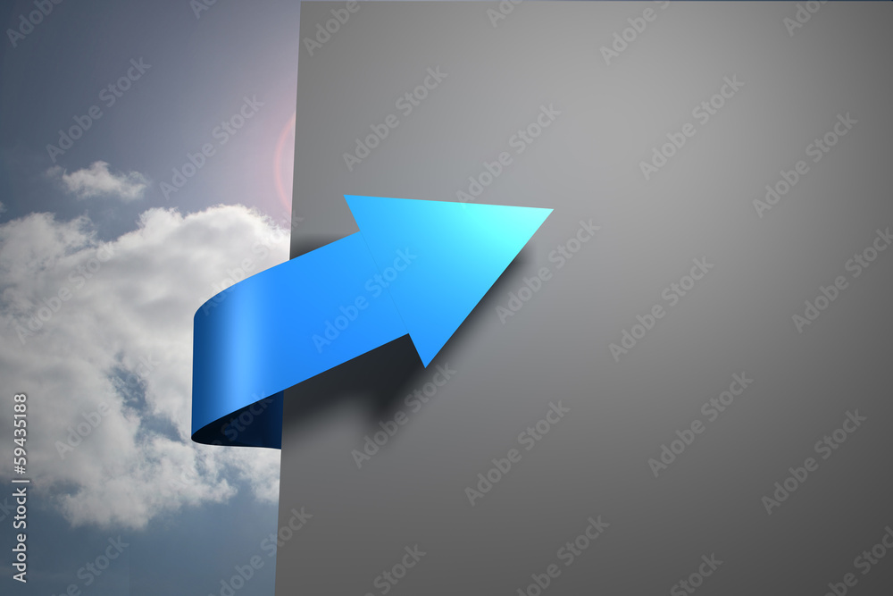 Blue arrow pointing against sky around grey wall Blue arrow pointing against sky around grey wall