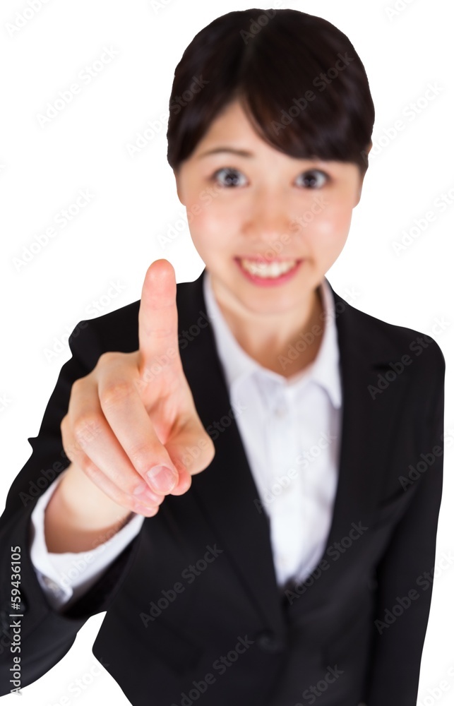 Smiling businesswoman pointing