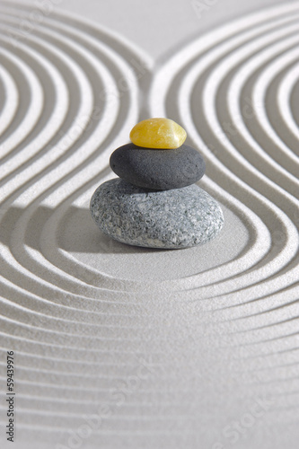 Japan zen garden with stones in raked sand photo