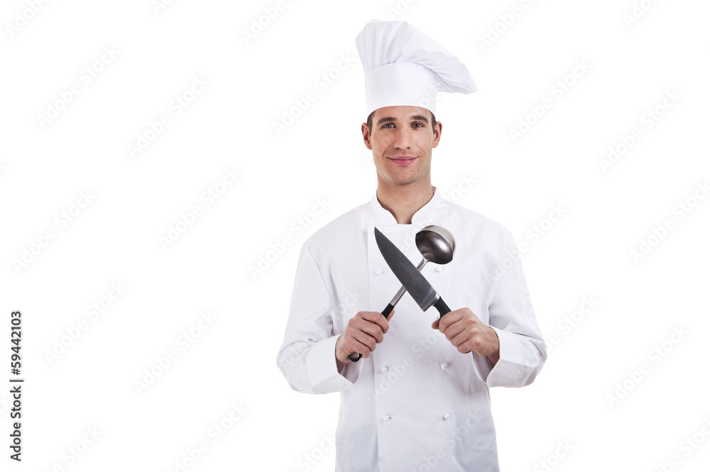 Chef. Isolated over white background. Holding knife and spoon Chef. Isolated over white background. Holding knife and spoon